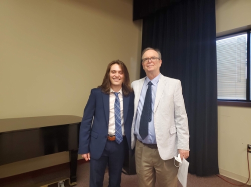 Tyler Jackson and Guitar professor, Dr. Terry Cantwell relax after the successful completion of Jackson’s solo performance required by his degree in Contemporary Musicianship on May 2 in the Arts Complex Rehearsal Hall.